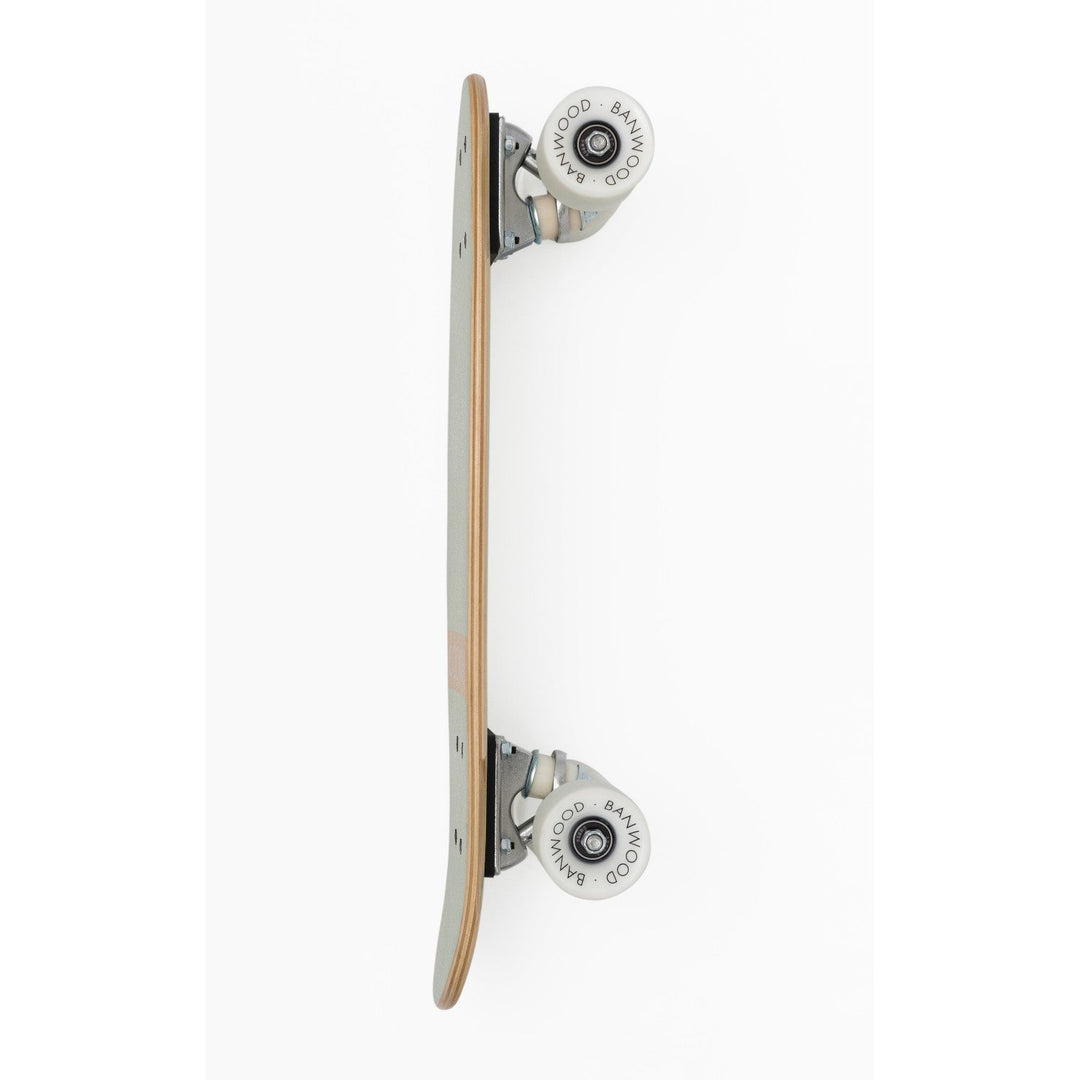Skateboard side view showing white rebound wheel and chrome truck detail