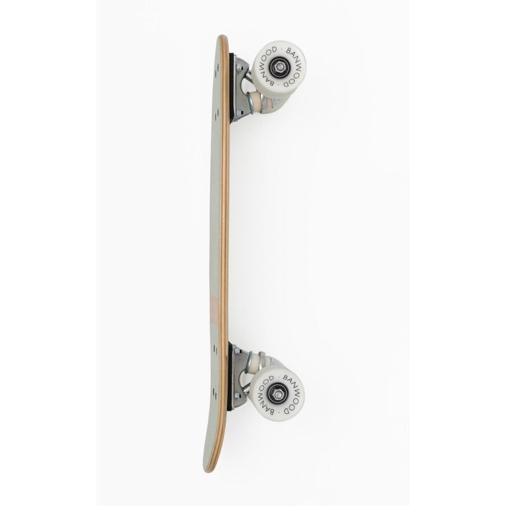 Skateboard side view showing white rebound wheel and chrome truck detail