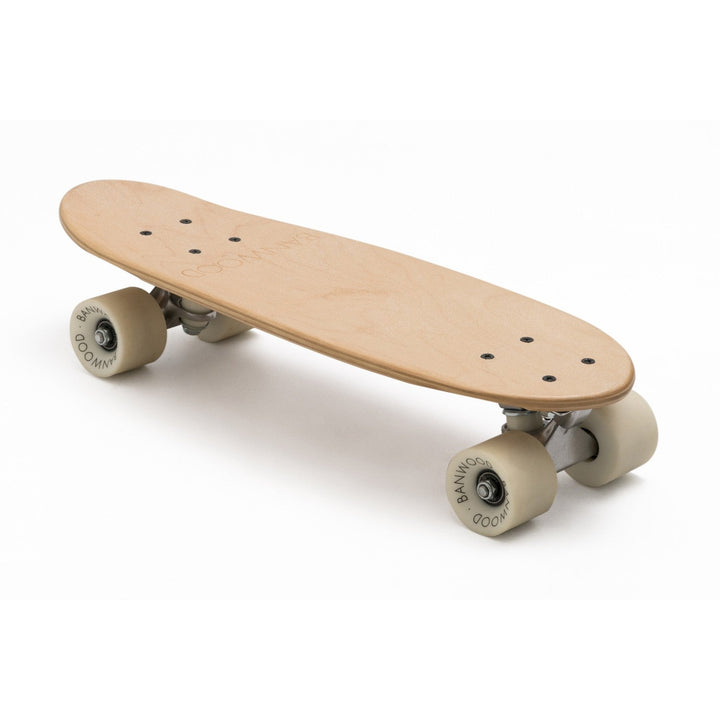 Three-quarter view of complete Banwood skateboard in natural wood