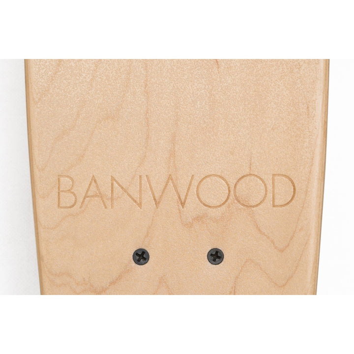 Banwood skateboard deck surface with engraved branding and mounting holes