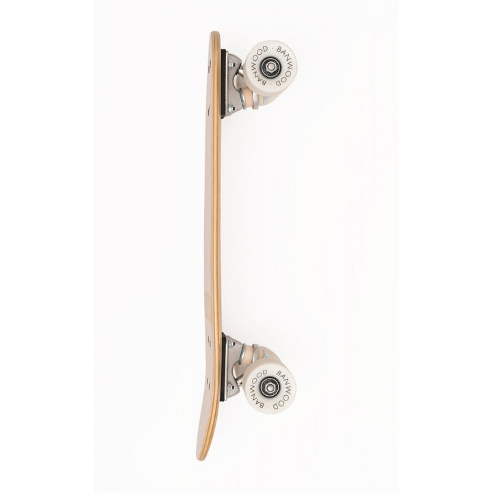 Skateboard side view with white rebounding wheels and metal truck bearing