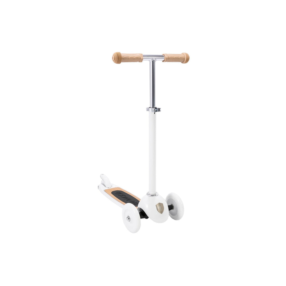 White scooter angled view showing front wheel positioning and deck